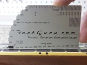 fretguru.com's string height gauge. Know how high the strings are before you buy.